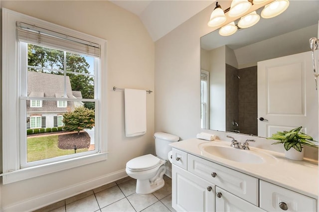 bathroom featuring a tile shower, vanity, tile patterned flooring, toilet, and lofted ceiling