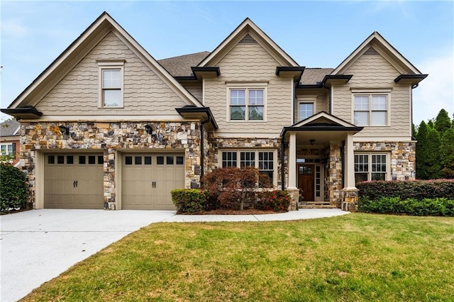 craftsman-style home featuring a garage and a front yard