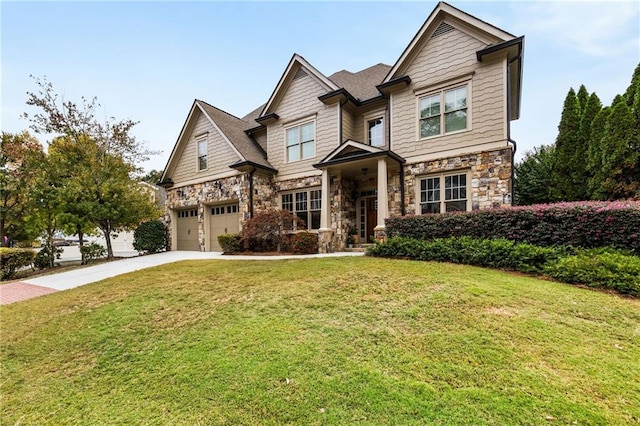 craftsman house with a garage and a front yard