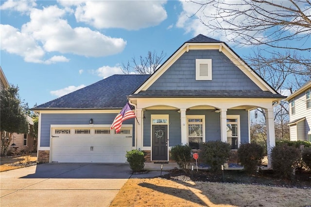 view of front of house with a garage and covered porch