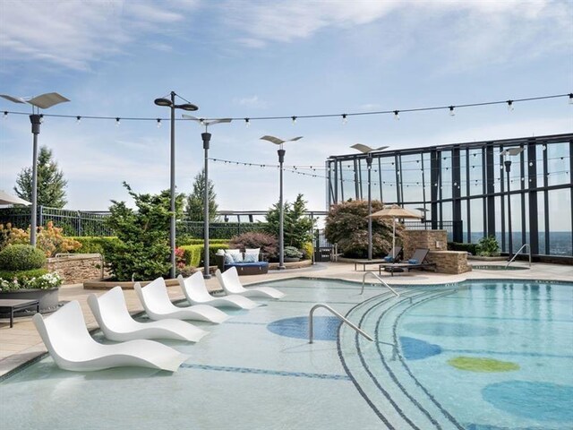 view of swimming pool featuring a patio area