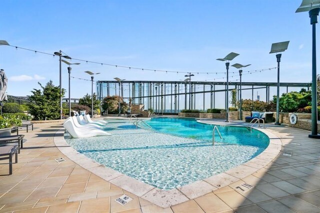 view of pool featuring a patio area