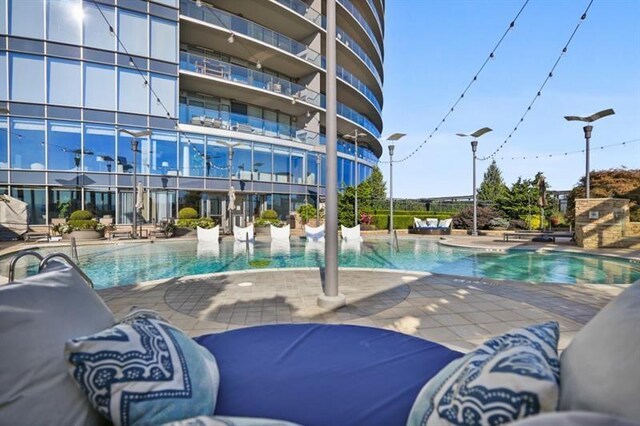 view of swimming pool with a patio area