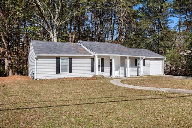 single story home with a front yard, a porch, and a garage