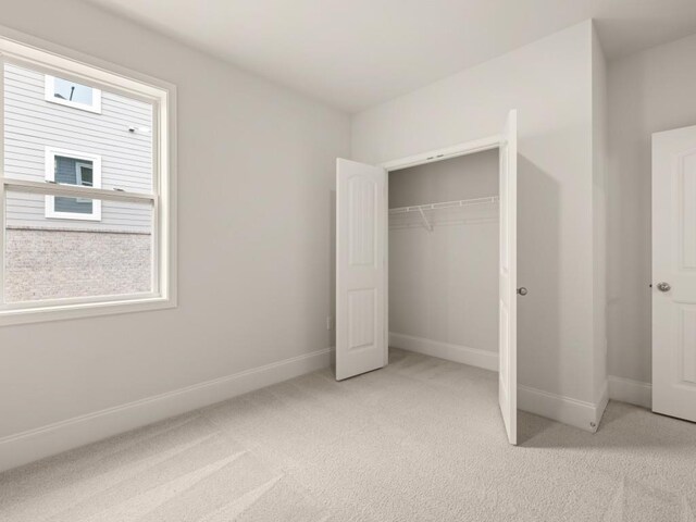 64 Parkview Dr, Dallas, GA 30157 - unfurnished bedroom featuring light carpet and a closet