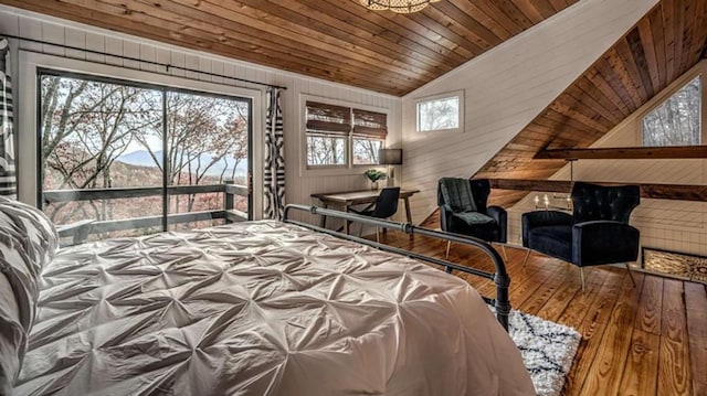 bedroom featuring hardwood / wood-style floors, wooden walls, wooden ceiling, lofted ceiling, and access to exterior