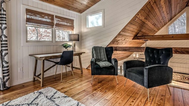 sitting room with wooden ceiling, wood finished floors, and vaulted ceiling