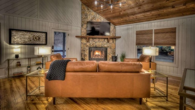 living room with wood finished floors, high vaulted ceiling, a fireplace, wood ceiling, and a chandelier