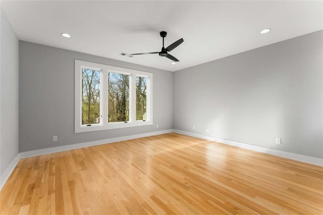 empty room featuring visible vents, baseboards, ceiling fan, recessed lighting, and light wood-style flooring