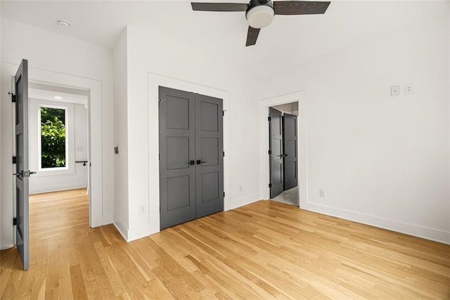 244 Locust St NE Unit B, Atlanta, GA 30317 - unfurnished bedroom with baseboards, light wood-type flooring, a closet, and a ceiling fan
