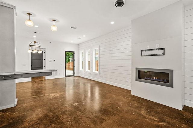 244 Locust St NE Unit B, Atlanta, GA 30317 - unfurnished living room featuring concrete flooring, a glass covered fireplace, and recessed lighting