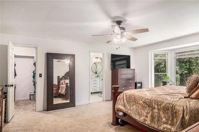 3003 Hanover Ln SE, Conyers, GA 30094 - carpeted bedroom with a spacious closet, ornamental molding, ensuite bathroom, and a ceiling fan