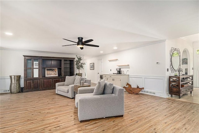 3003 Hanover Ln SE, Conyers, GA 30094 - living room with ornamental molding, light wood-type flooring, ceiling fan, recessed lighting, and arched walkways