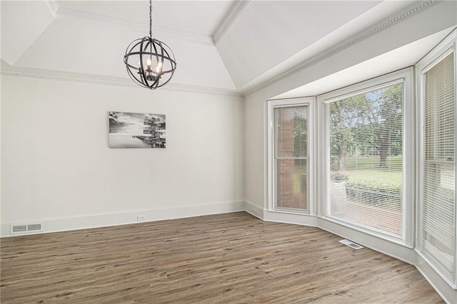 3003 Hanover Ln SE, Conyers, GA 30094 - unfurnished dining area with a chandelier, wood finished floors, crown molding, a tray ceiling, and lofted ceiling