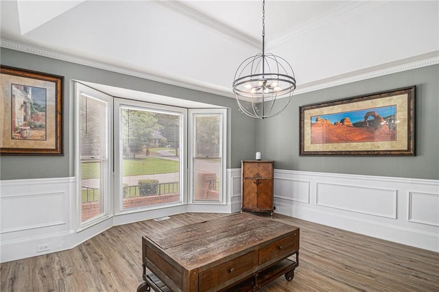 3003 Hanover Ln SE, Conyers, GA 30094 - sitting room featuring a chandelier, wood finished floors, ornamental molding, wainscoting, and a decorative wall