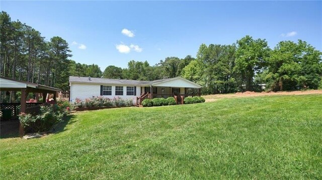 88 Turner Rd, Jasper, GA 30143 - rear view of house featuring a yard