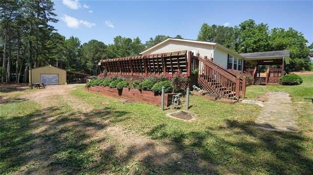 88 Turner Rd, Jasper, GA 30143 - unfurnished living room featuring wood finished floors, a fireplace, ceiling fan, crown molding, and vaulted ceiling