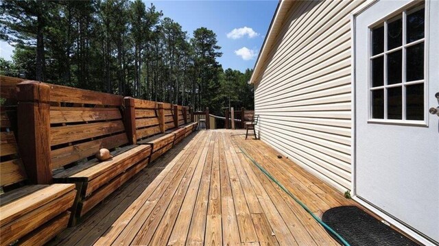88 Turner Rd, Jasper, GA 30143 - unfurnished living room featuring ceiling fan, wood finished floors, and a large fireplace