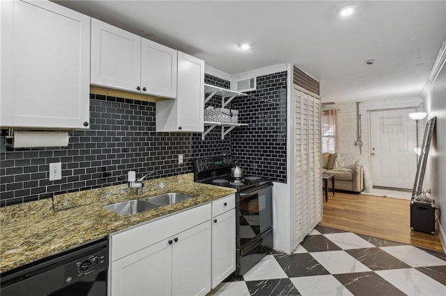 kitchen featuring open shelves, a sink, white cabinetry, black appliances, and tasteful backsplash