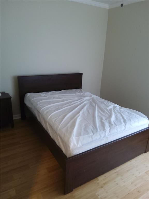 bedroom featuring hardwood / wood-style flooring