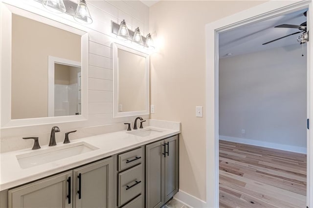 bathroom featuring ceiling fan, vanity, and hardwood / wood-style floors