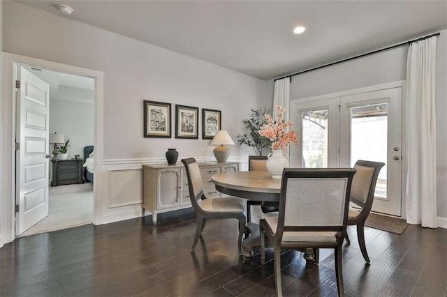 dining space featuring dark wood-type flooring