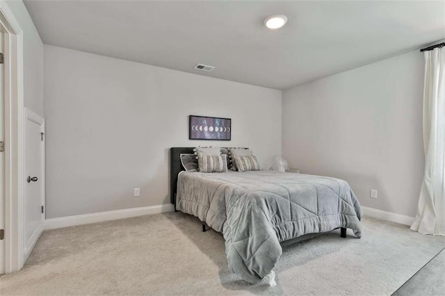 bedroom featuring light carpet