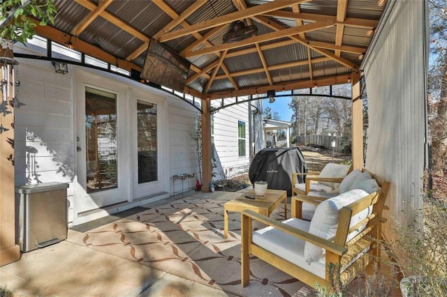 view of patio / terrace featuring a gazebo and a grill