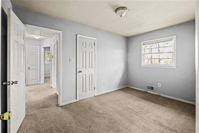 empty room with light colored carpet