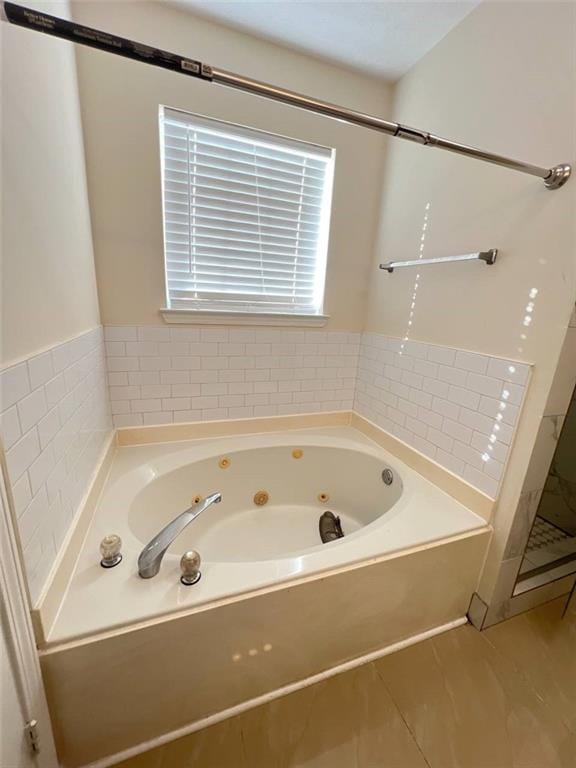 bathroom with shower with separate bathtub