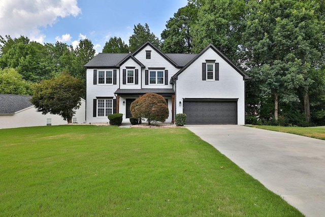 view of front of home with a garage and a front yard