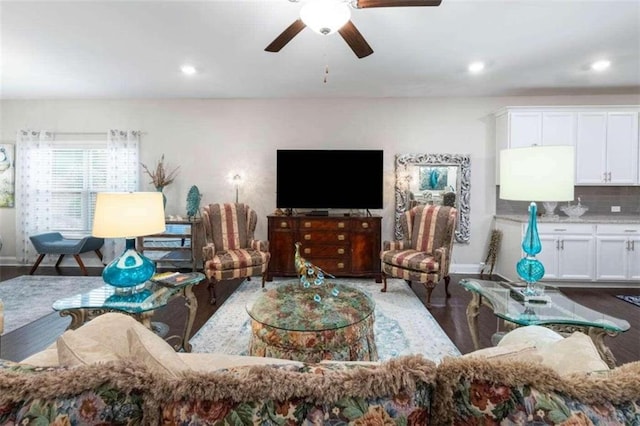 living room featuring hardwood / wood-style floors and ceiling fan