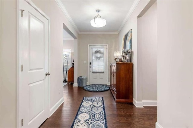 doorway featuring ornamental molding and dark wood-type flooring