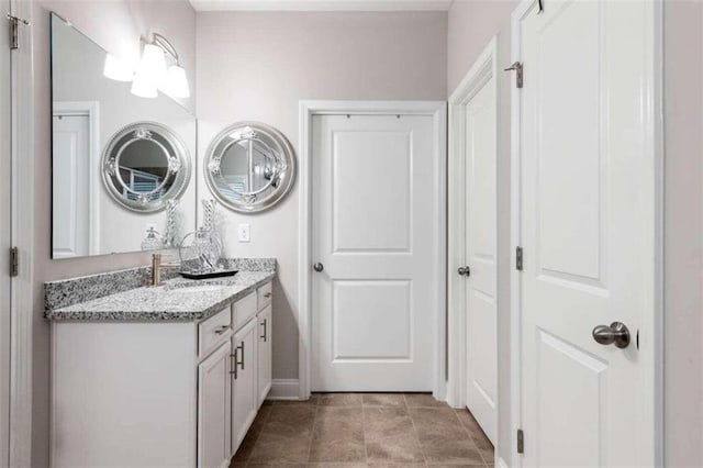 bathroom featuring tile patterned floors and vanity