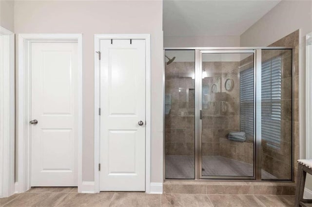 bathroom featuring tile patterned flooring and walk in shower