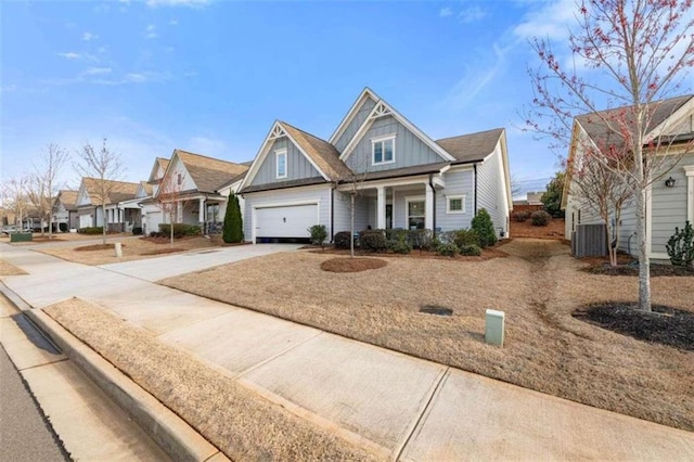 craftsman house featuring covered porch and cooling unit