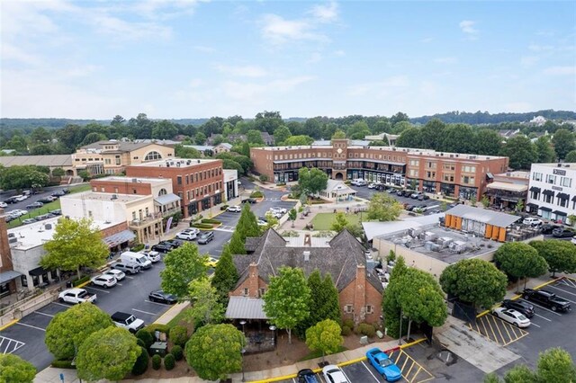 drone / aerial view featuring a residential view and a water view