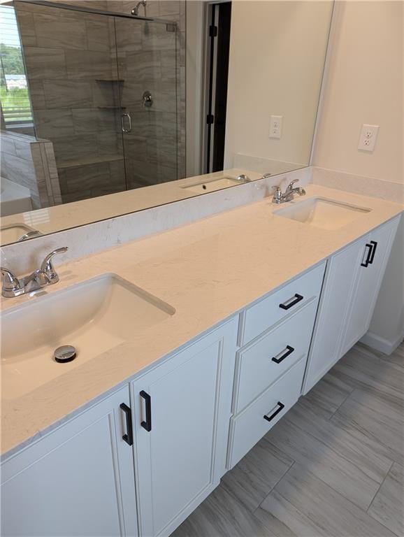 bathroom with vanity and an enclosed shower