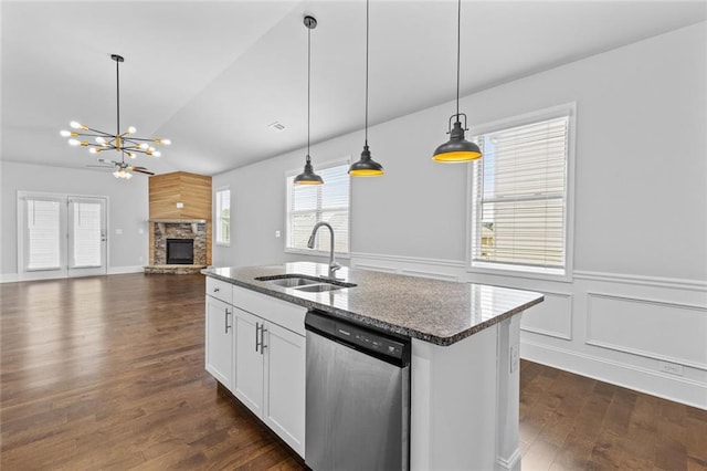 6469 Crosscreek Ln, Flowery Branch, GA 30542 - kitchen with dishwasher, lofted ceiling, a fireplace, dark wood-type flooring, and a chandelier
