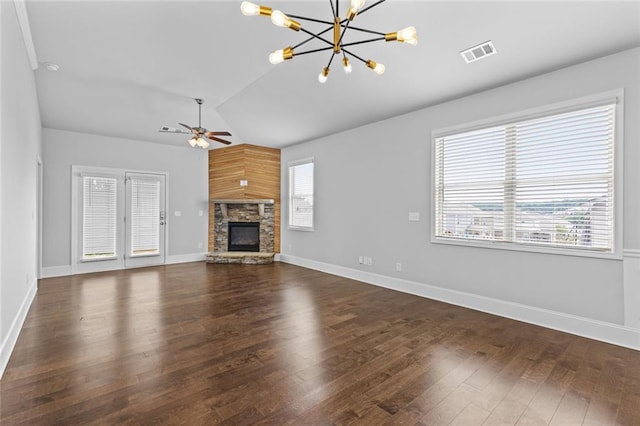 6469 Crosscreek Ln, Flowery Branch, GA 30542 - unfurnished living room featuring lofted ceiling, a chandelier, healthy amount of natural light, a ceiling fan, and wood finished floors