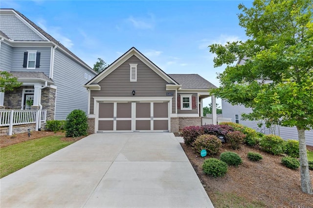 6469 Crosscreek Ln, Flowery Branch, GA 30542 - craftsman house with driveway and an attached garage