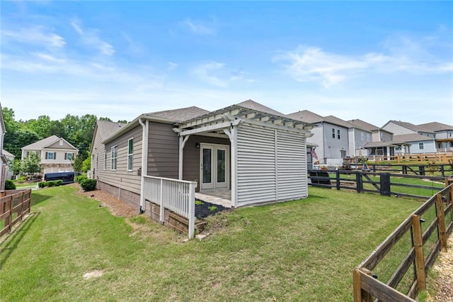 6469 Crosscreek Ln, Flowery Branch, GA 30542 - view of home's exterior featuring a pergola, a fenced backyard, french doors, a residential view, and a shingled roof
