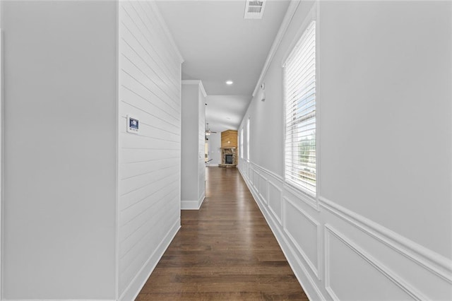 6469 Crosscreek Ln, Flowery Branch, GA 30542 - hallway with recessed lighting, dark wood-style floors, crown molding, a decorative wall, and wainscoting