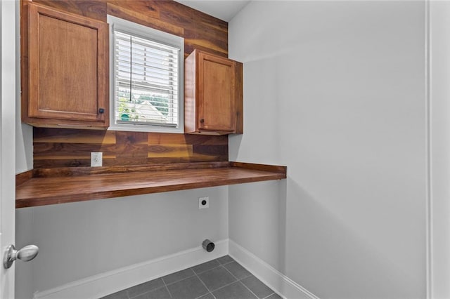 6469 Crosscreek Ln, Flowery Branch, GA 30542 - laundry room with hookup for an electric dryer, dark tile patterned floors, and cabinet space