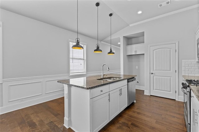 6469 Crosscreek Ln, Flowery Branch, GA 30542 - kitchen featuring appliances with stainless steel finishes, dark stone counters, white cabinets, dark wood finished floors, and pendant lighting