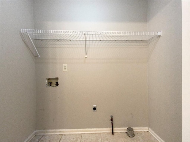 laundry area with tile patterned flooring, hookup for an electric dryer, and washer hookup