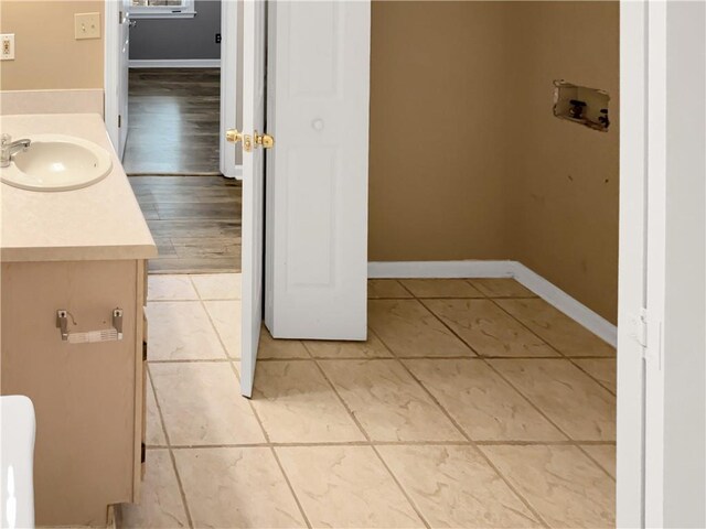 bathroom featuring wood-type flooring and vanity