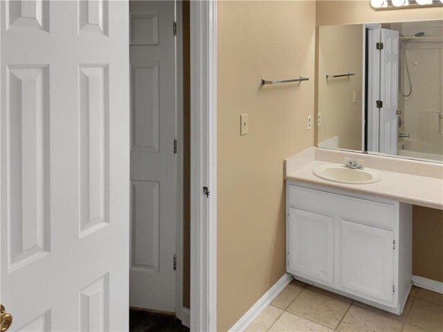 bathroom featuring shower / tub combination, vanity, and tile patterned floors