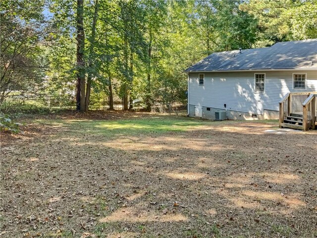 view of yard with central AC