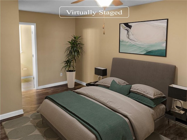 bedroom featuring ensuite bath and dark hardwood / wood-style floors